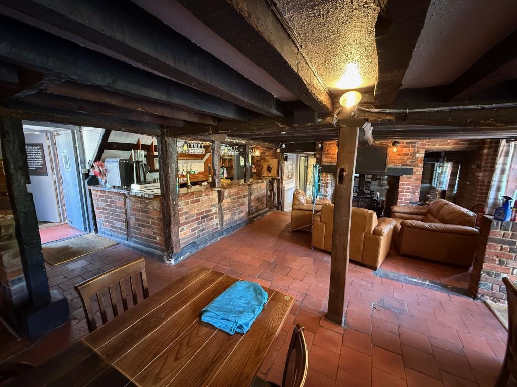Lot: 102 - PUBLIC HOUSE - Traditional pub serving area with exposed ceiling beams